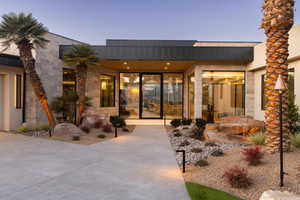 Entrance to property with stone siding