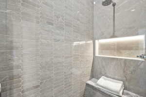 Bathroom featuring a tile shower