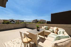 View of patio with outdoor lounge area, a mountain view, and outdoor dining space