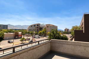 Balcony with a mountain view and a city view
