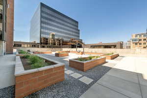 View of home's community featuring a garden
