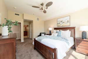 Bedroom featuring light colored carpet and a ceiling fan