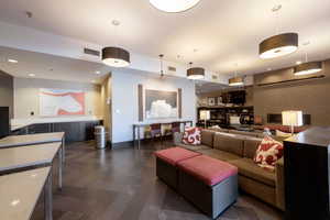 Living room with recessed lighting and baseboards