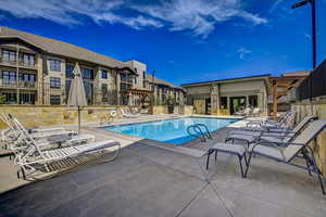 Community pool featuring a patio area
