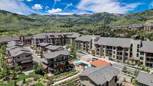 Aerial view of residential area featuring a mountain backdrop