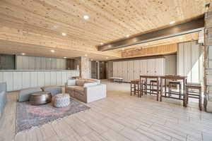 Lobby featuring wood walls, wood ceiling, and recessed lighting