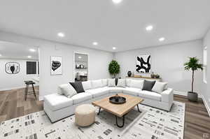 Living area with recessed lighting and wood finished floors