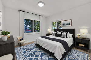 Bedroom with dark wood-style flooring