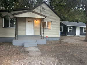Bungalow featuring covered porch