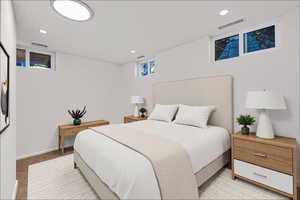 Bedroom with recessed lighting and baseboards