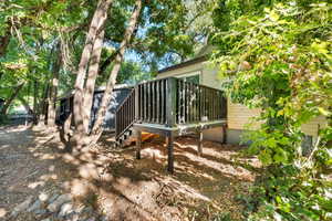 Rear view of property with a deck