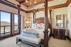 Bedroom featuring access to exterior, wooden ceiling, a chandelier, and a mountain view