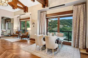 Dining area featuring arched walkways and baseboards