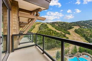 Balcony with view of pool area
