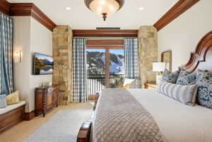 Bedroom with carpet flooring, access to outside, and crown molding