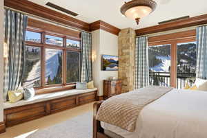 Bedroom featuring access to outside, ornamental molding, and carpet floors