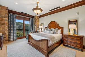 Bedroom featuring crown molding, access to outside, and carpet