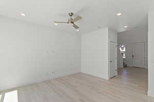 Empty room with stairway, light wood-type flooring, recessed lighting, and a ceiling fan