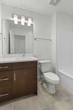 Bathroom with vanity and tile patterned flooring