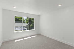 Spare room with carpet flooring and recessed lighting