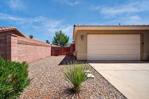 Garage with a gate and driveway