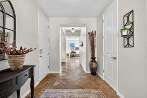 Hall with stone tile flooring