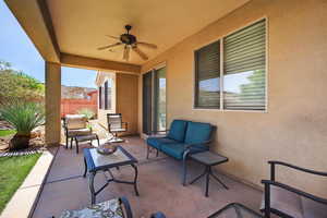 View of patio with a ceiling fan and outdoor lounge area