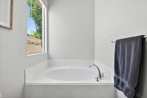 Full bathroom featuring a garden tub