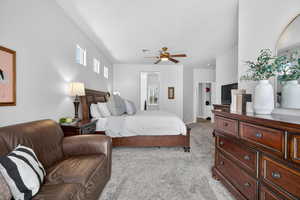 Bedroom with light colored carpet and ceiling fan