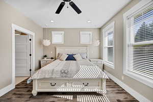 Bedroom featuring dark wood-style floors, recessed lighting, and a ceiling fan