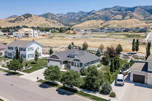 Aerial perspective of suburban area featuring a mountainous background