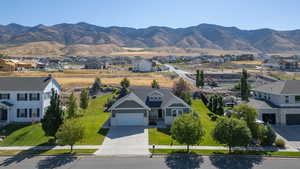 Aerial perspective of suburban area featuring a mountainous background