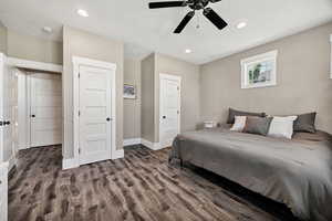 Bedroom featuring recessed lighting, dark wood-type flooring, and a ceiling fan