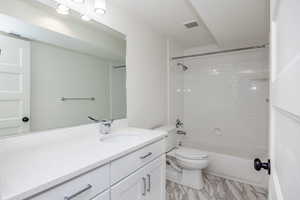 Full bathroom with vanity, shower / bathtub combination, and marble finish floors