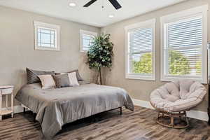 Bedroom featuring wood finished floors, recessed lighting, and a ceiling fan