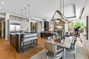 Dining room featuring light wood finished floors, recessed lighting, and a chandelier