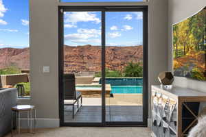 Doorway to outside featuring a mountain view