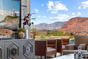 View of patio / terrace featuring a mountain view and a fire pit