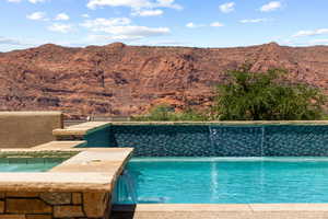 Outdoor pool featuring a mountain view
