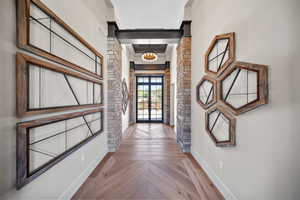 Doorway to outside with baseboards