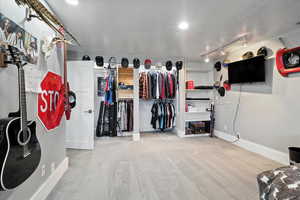 Spacious closet featuring carpet flooring