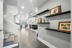 Foyer with stairway and recessed lighting