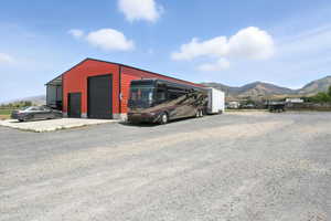 View of outbuilding with a mountain view