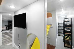 Detailed view of a textured ceiling and wood finished floors