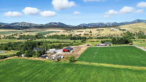 Overview of rural landscape featuring a mountainous background