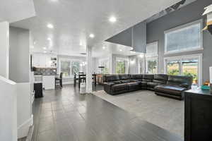 Living room with a chandelier and recessed lighting