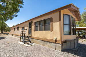View of front of home featuring crawl space