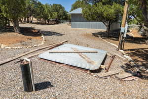View of yard featuring fence and a deck