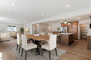 Dining area featuring light wood-style floors and recessed lighting