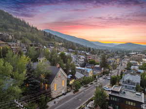 Aerial view at dusk of a mountain view and a residential view